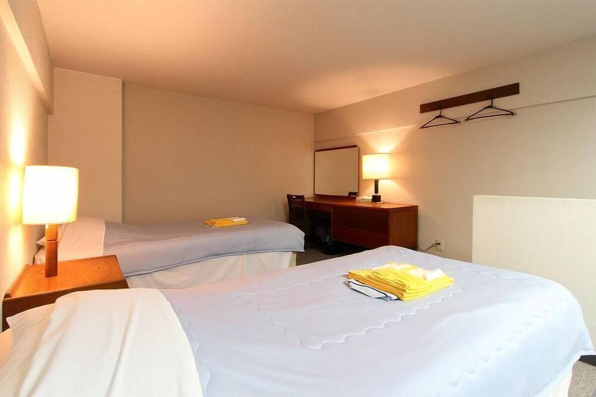 desk, laptop workspace, blackout curtains, iron/ironing board