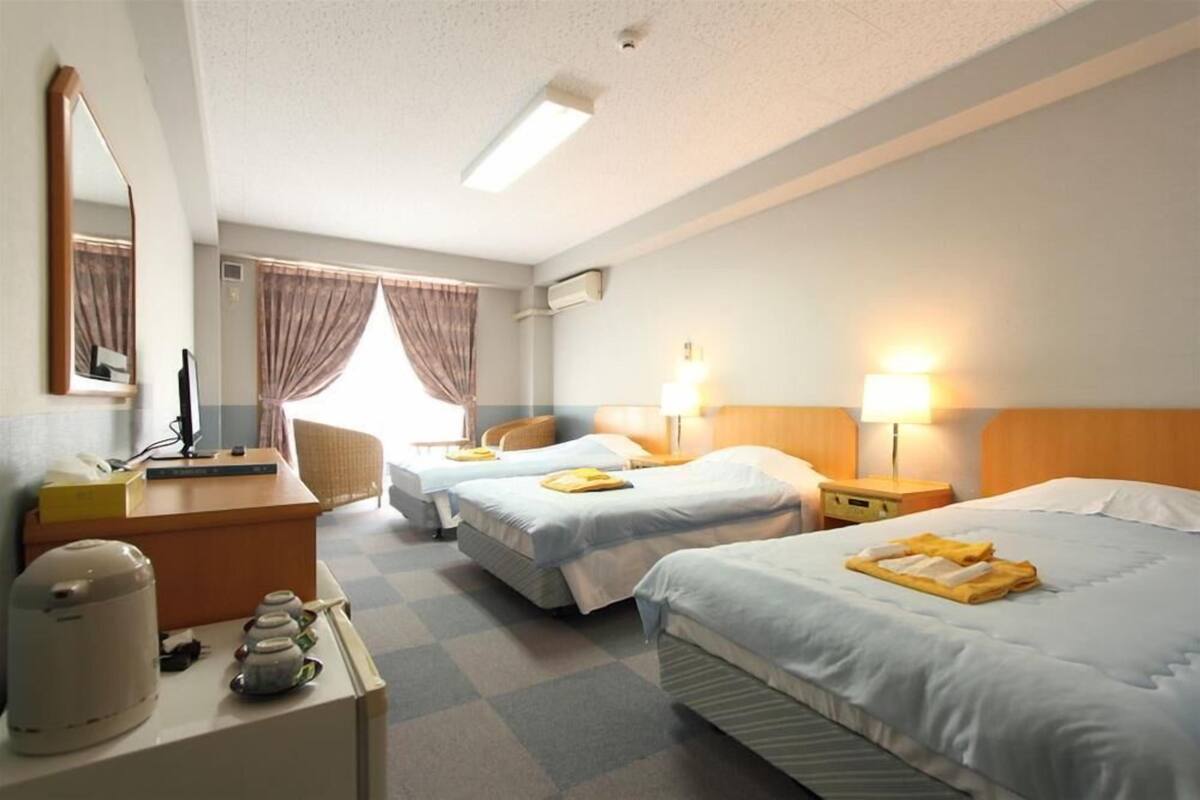 desk, laptop workspace, blackout curtains, iron/ironing board