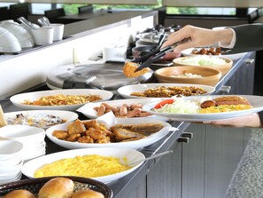 A buffet with various dishes including meats, vegetables, and salads. - Smile Hotel FukuokaOkawa (Okawa)
