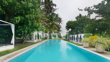 Outdoor pool, free cabanas, pool umbrellas