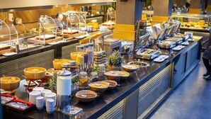 A buffet with various food items and serving utensils. - Pgs Hotels Casa Del Sol (Kata)