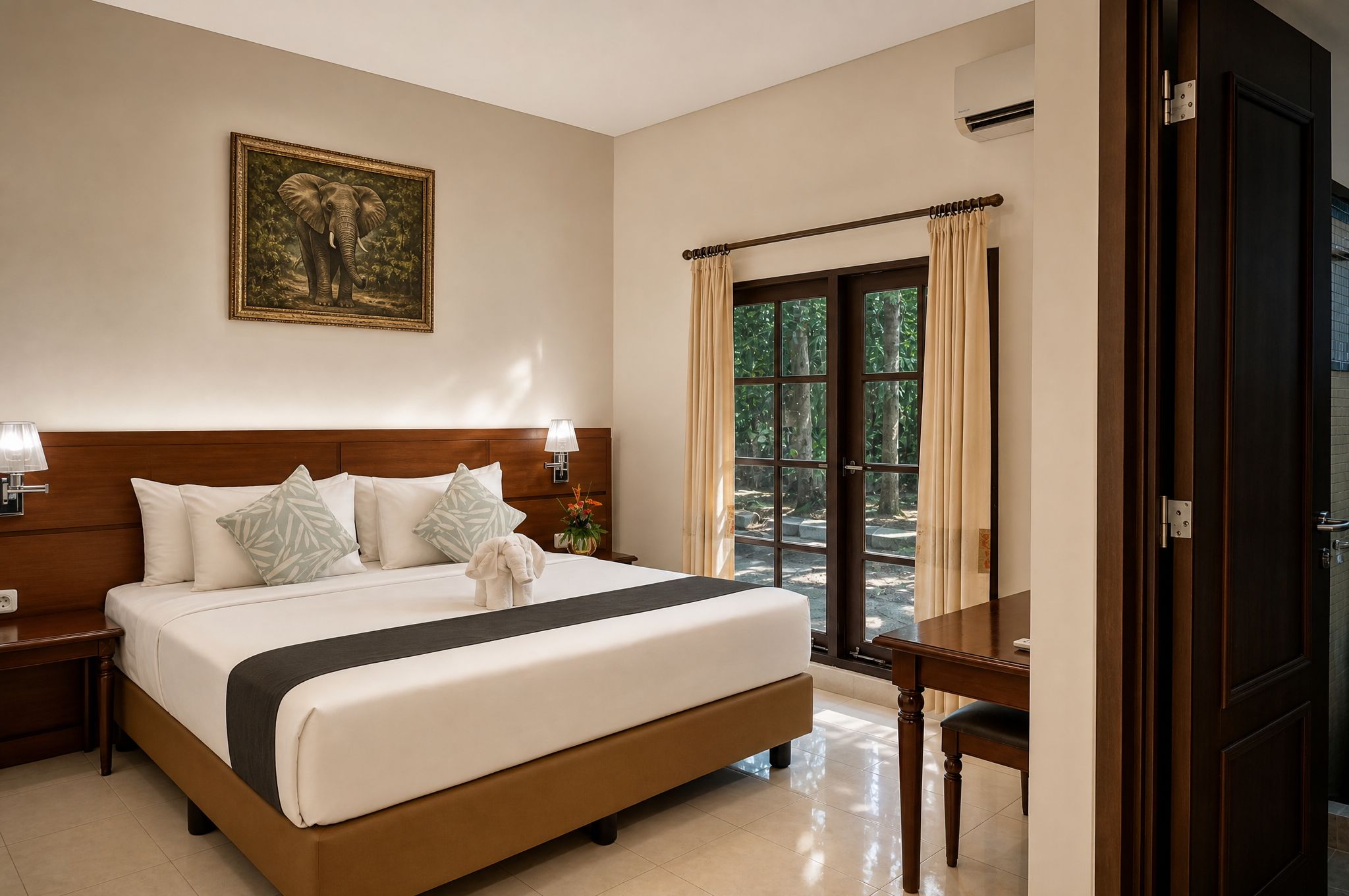 A hotel room with a large bed, a nightstand, a lamp, a painting of an elephant, and a view of the outdoors through a door.