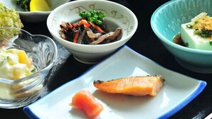 A variety of Japanese dishes including sushi, rice, and pickled vegetables. - First Inn Haiki (Sasebo)