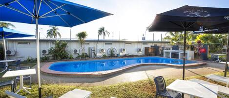 Outdoor pool, open 7:00 AM to 8:00 PM, pool loungers