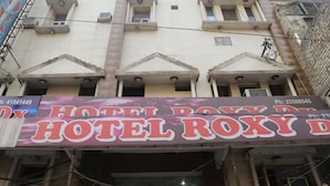 A hotel with a prominent sign reading "HOTEL ROXY D". - Roxy Dx (New Delhi)