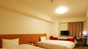 A hotel room with two beds, a desk with a chair, a television, and a window with curtains. - Century Art (Fukuoka)