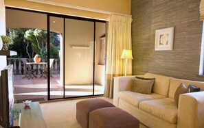 Luxury Suite, 1 Bedroom (Balcony Suite) | In-room safe, desk, laptop workspace, iron/ironing board