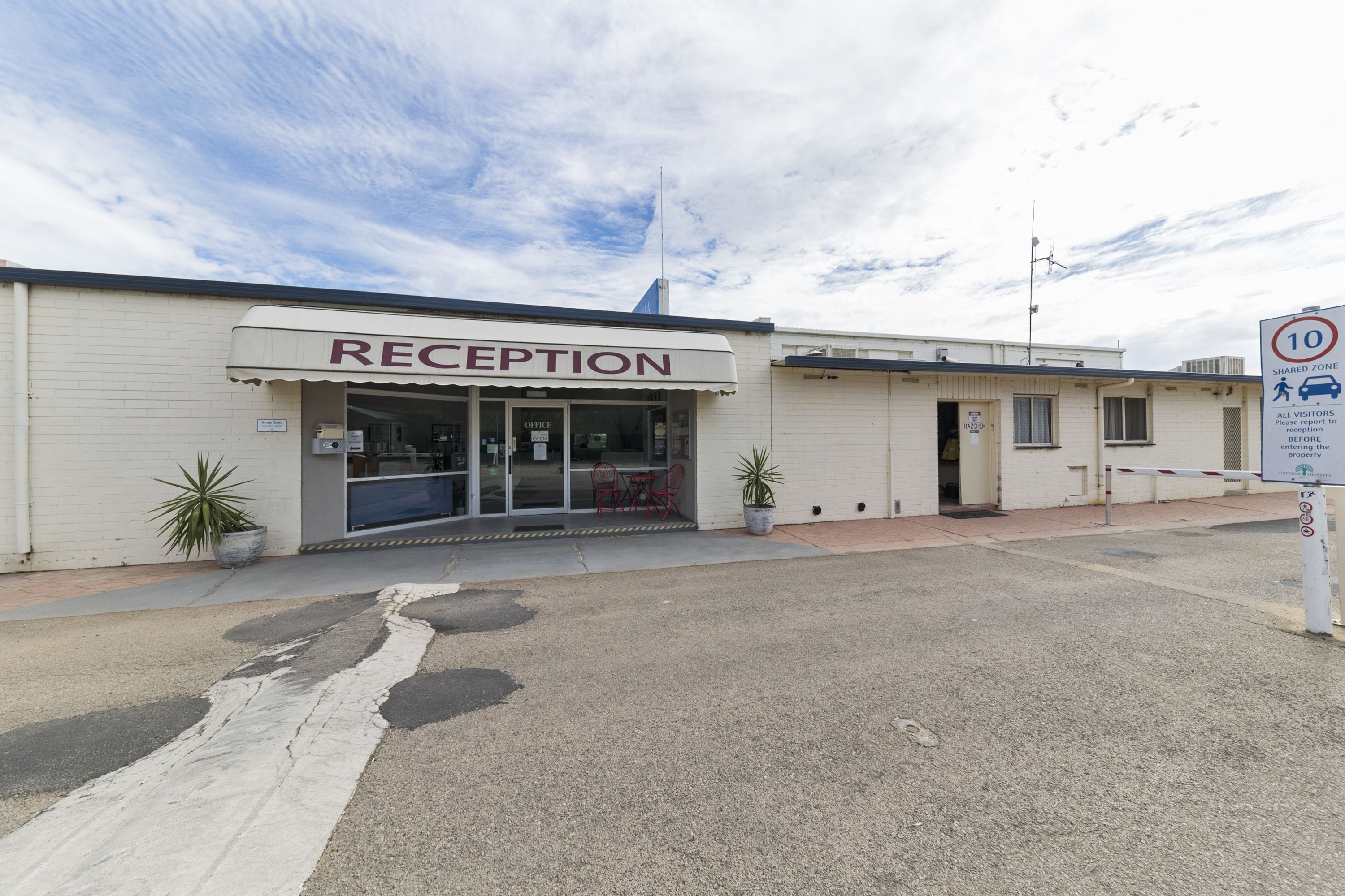 A reception area with a sign reading "RECEPTION" above the entrance.