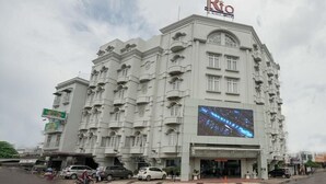A large hotel with a prominent 'Rio' sign, multiple balconies, and a large digital display on the facade.