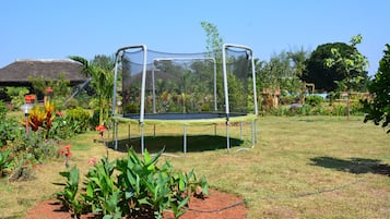 Enjoy a fun-filled stay with a trampoline and lush garden surroundings.