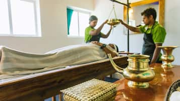 Guests can enjoy a soothing massage on a comfortable bed, attended by a skilled therapist.
