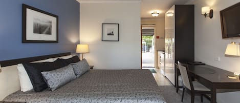 Quarto executivo | Frigobar, cortinas blackout, ferros/tábuas de passar roupa