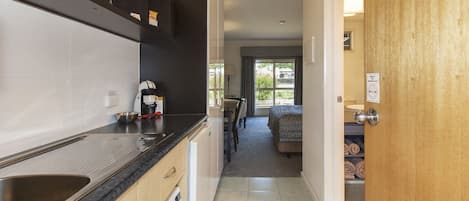 Executive Room | Private kitchen | Fridge, microwave