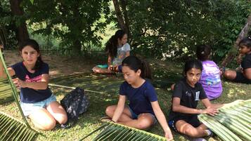 Guests can enjoy nature-based activities in our serene outdoor setting surrounded by lush greenery.