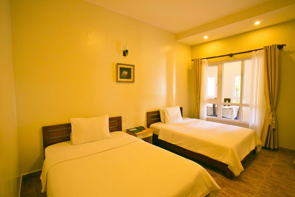 Apartamento executivo, 2 camas de solteiro | Escrivaninha, cortinas blackout, Wi-Fi de cortesia