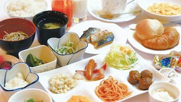 A variety of dishes including rice, noodles, and meatballs, suggesting a diverse meal selection.