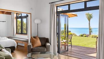 Panoramic Villa | Living area | Flat-screen TV, DVD player, iPod dock