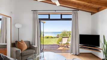 Panoramic Villa | Living area | Flat-screen TV, DVD player, iPod dock