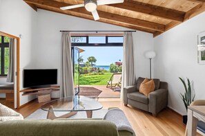 Garden View Cottage | Living area | Flat-screen TV, DVD player, iPod dock - Adrift In Golden Bay (Parapara)