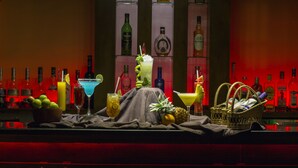 A bar area with various bottles and a selection of drinks on the counter. - Kithala Resort (Thissamaharama)