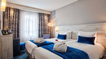 Colchones con pillow-top y minibar con artículos gratuitos