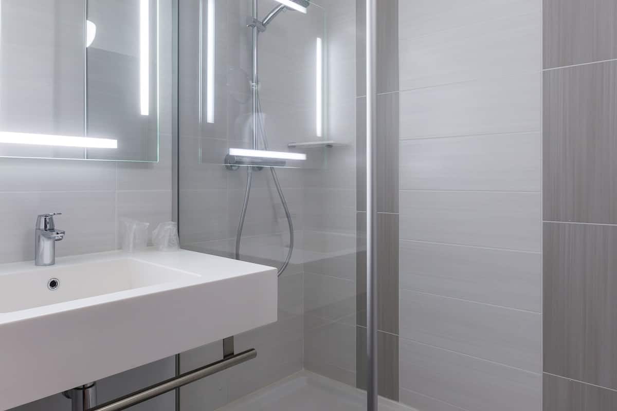 standard twin room, 2 single beds | bathroom | rainfall showerhead, eco-friendly toiletries, hair dryer, towels