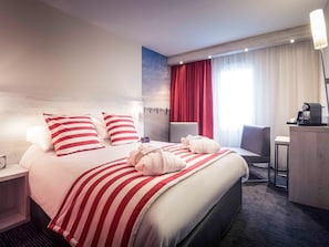 Pillow-top beds, free minibar, in-room safe, desk