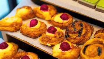 A tray of pastries with fruit toppings.