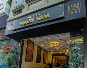 The exterior of Hotel Vong Xua with its name prominently displayed.