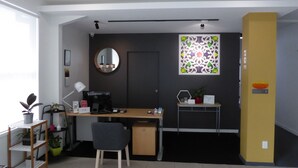 A modern office space with a desk, chair, computer, and shelves. - Parnell Pines (Auckland)