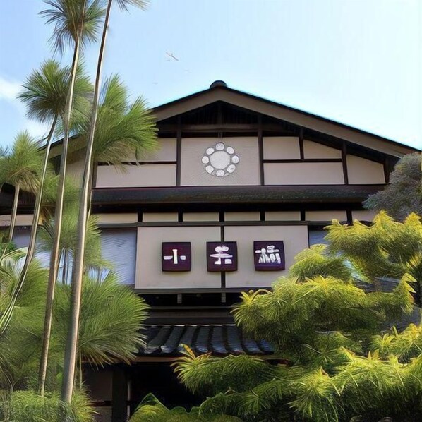A traditional building with a tiled roof and a sign with Japanese characters. - Kumihama Onsenkyo Shotenkyo (Kyotango)