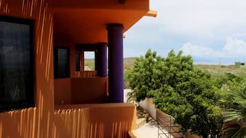 Habitación Deluxe, 1 cama Queen size, vista al océano | Vista a la playa o el mar