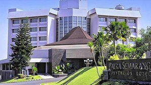 A modern building with a prominent sign for 'Pitra Semarang Convention Hotel.' - Patra Semarang Convention (SEMARANG)