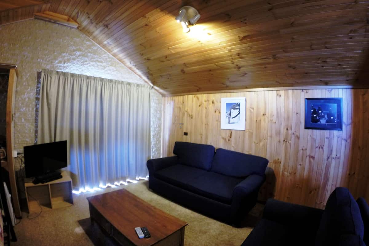 Howqua Apartment | Living area | 34-inch flat-screen TV with digital channels, TV, DVD player