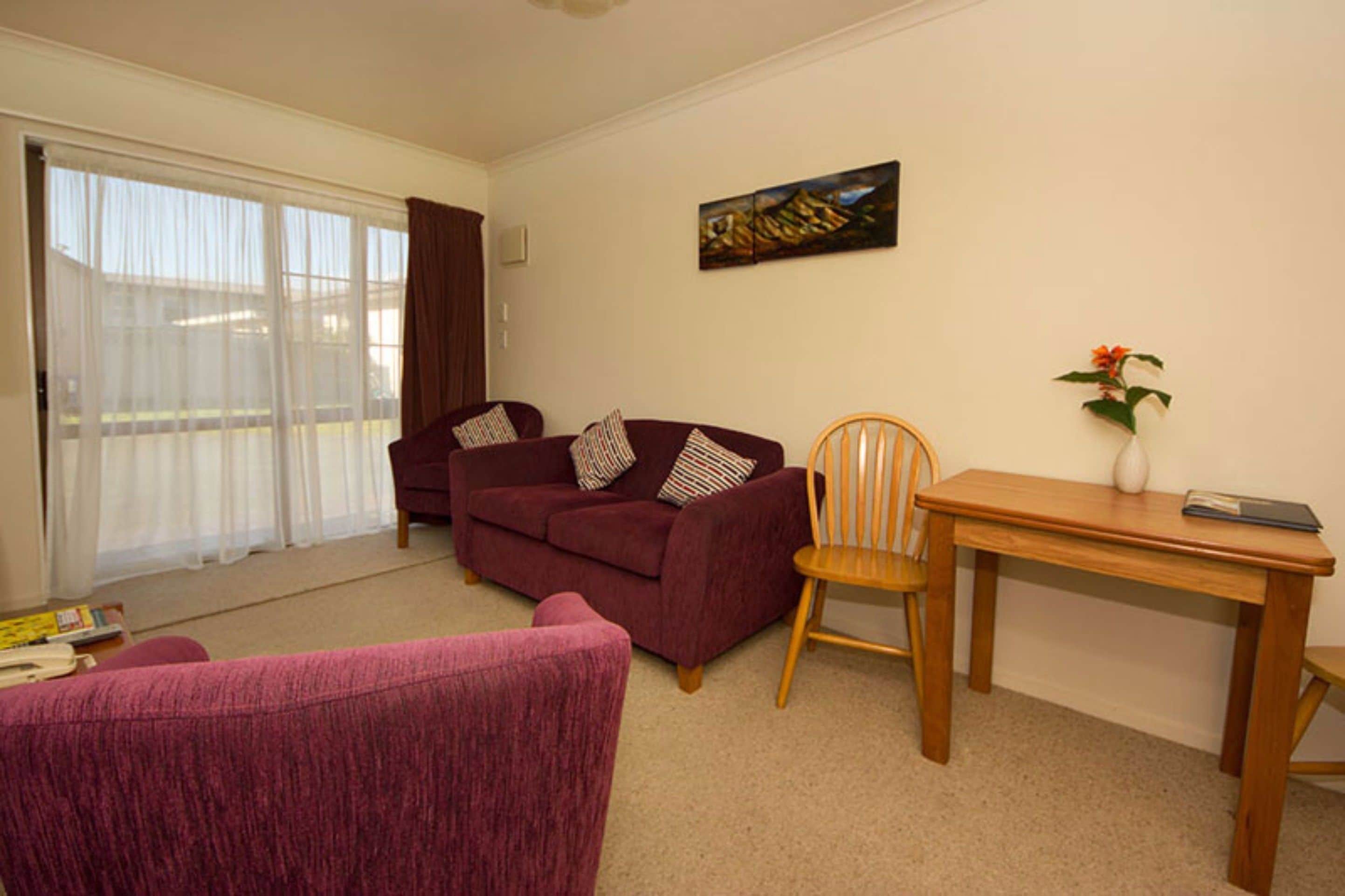 Apartment, 2 Bedrooms (Room 803) | Living area | Flat-screen TV, DVD player