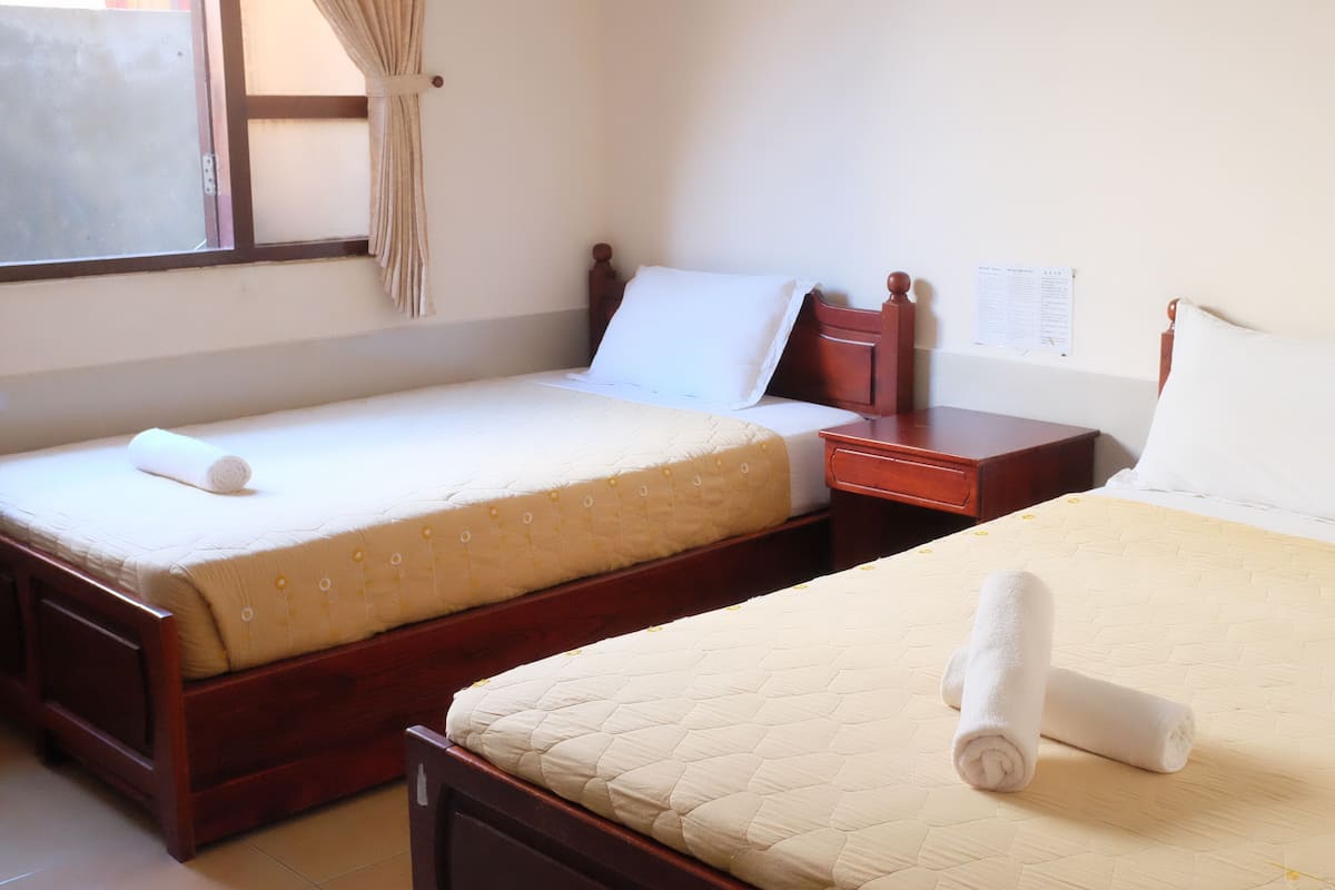 Triple Room | Minibar, in-room safe, desk, blackout drapes