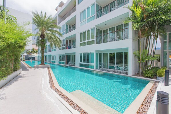 2 outdoor pools, open 8 AM to 8 PM, pool umbrellas, pool loungers