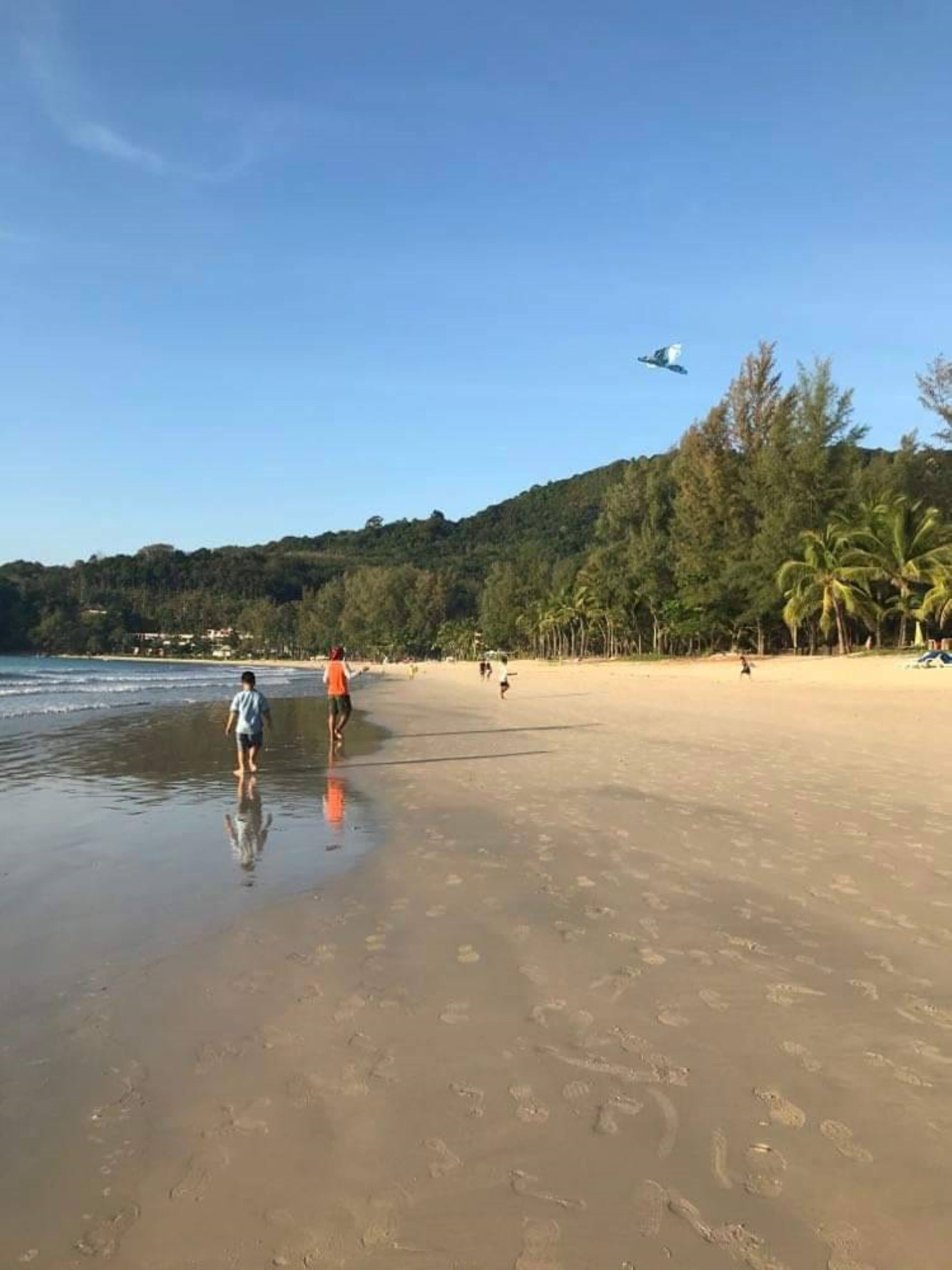 Beach nearby, white sand, beach towels
