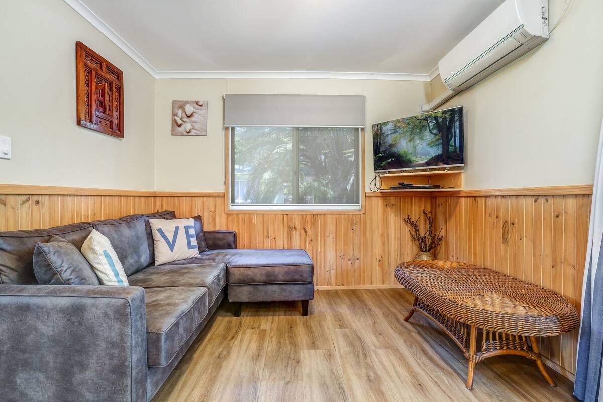 Basic Cabin (Beach Huts) | Living area | Flat-screen TV, DVD player