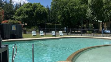 Outdoor pool, open 9 AM to 8 PM, pool umbrellas, pool loungers