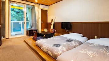 Desk, iron/ironing board, bed sheets