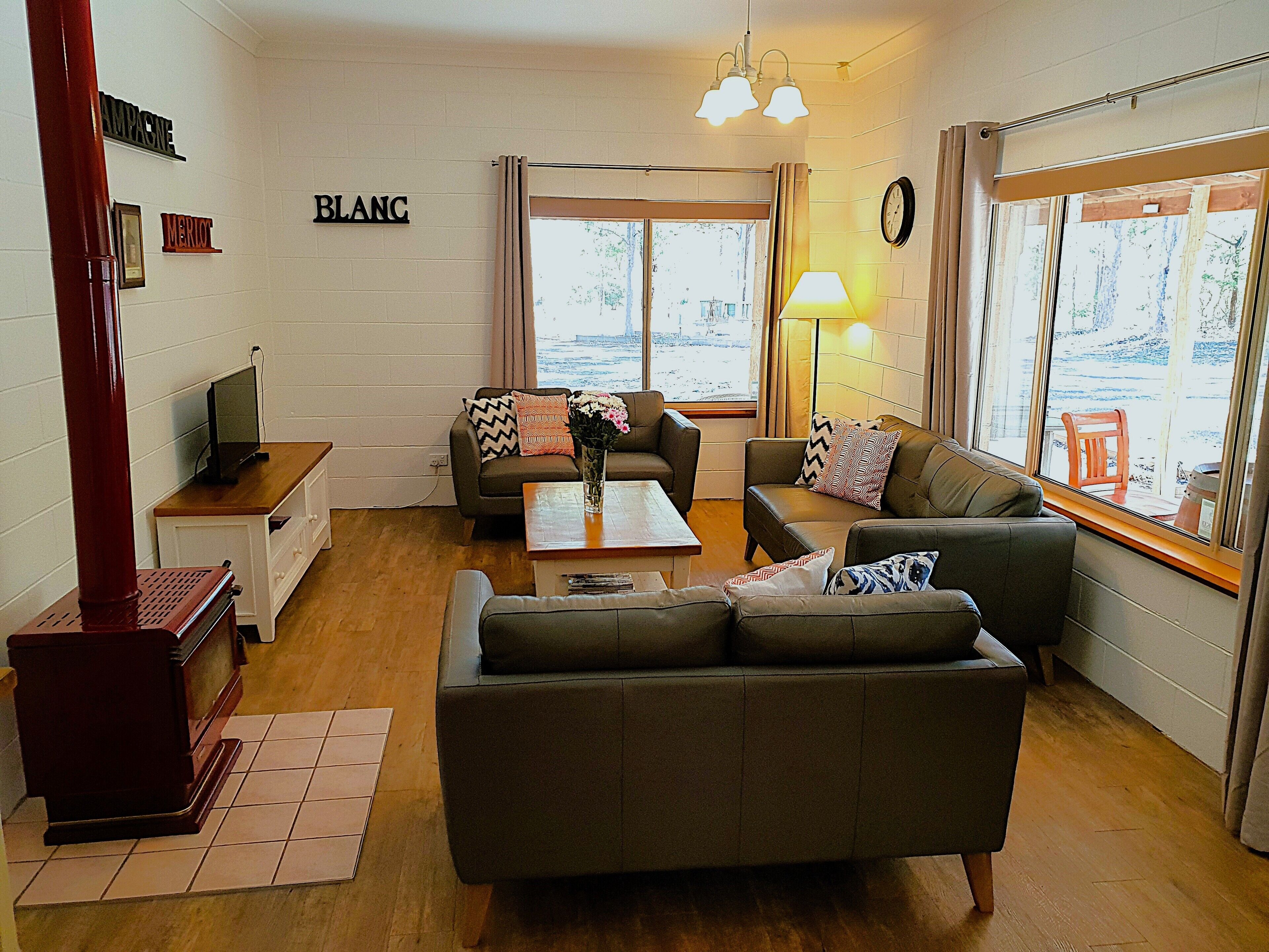 Kookaburra Cottage | Living area | 55-inch Smart TV with digital channels, fireplace, DVD player