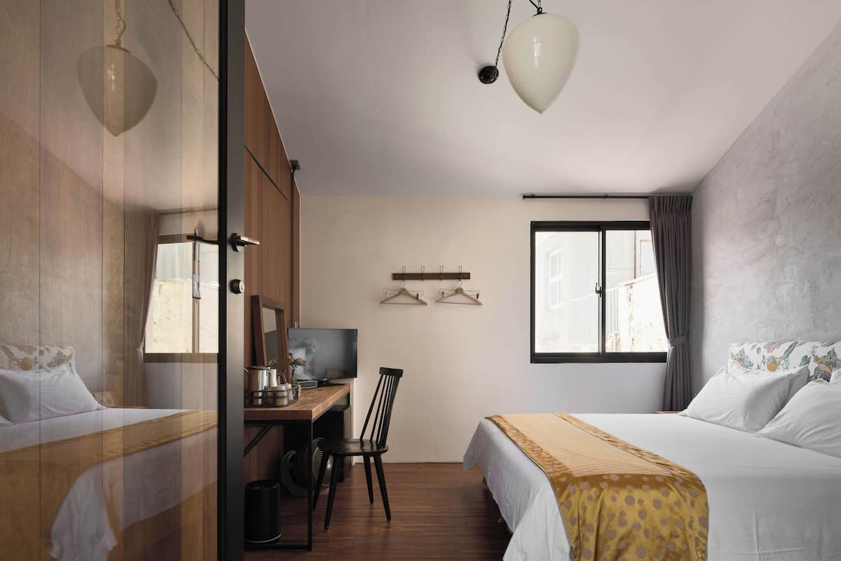 Habitació doble Deluxe | Cobrellits, cortines opaques, wifi gratuïta i roba de llit