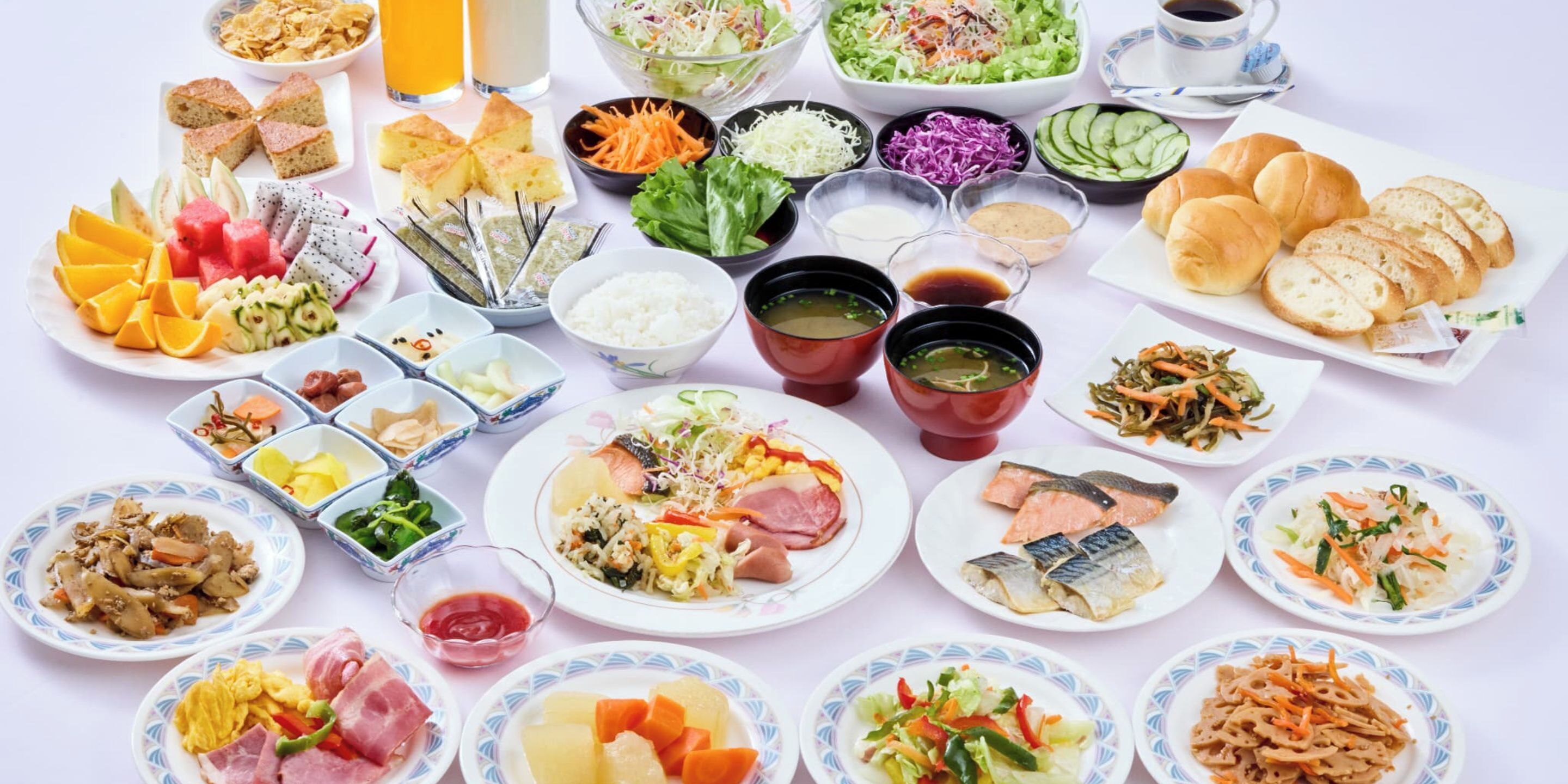 A variety of dishes and drinks arranged on a table.
