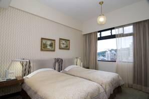 Twin Room, 2 Single Beds | In-room safe, desk, blackout curtains - Kingship Hotel Kaohsiung Inter Continental (Kaohsiung)