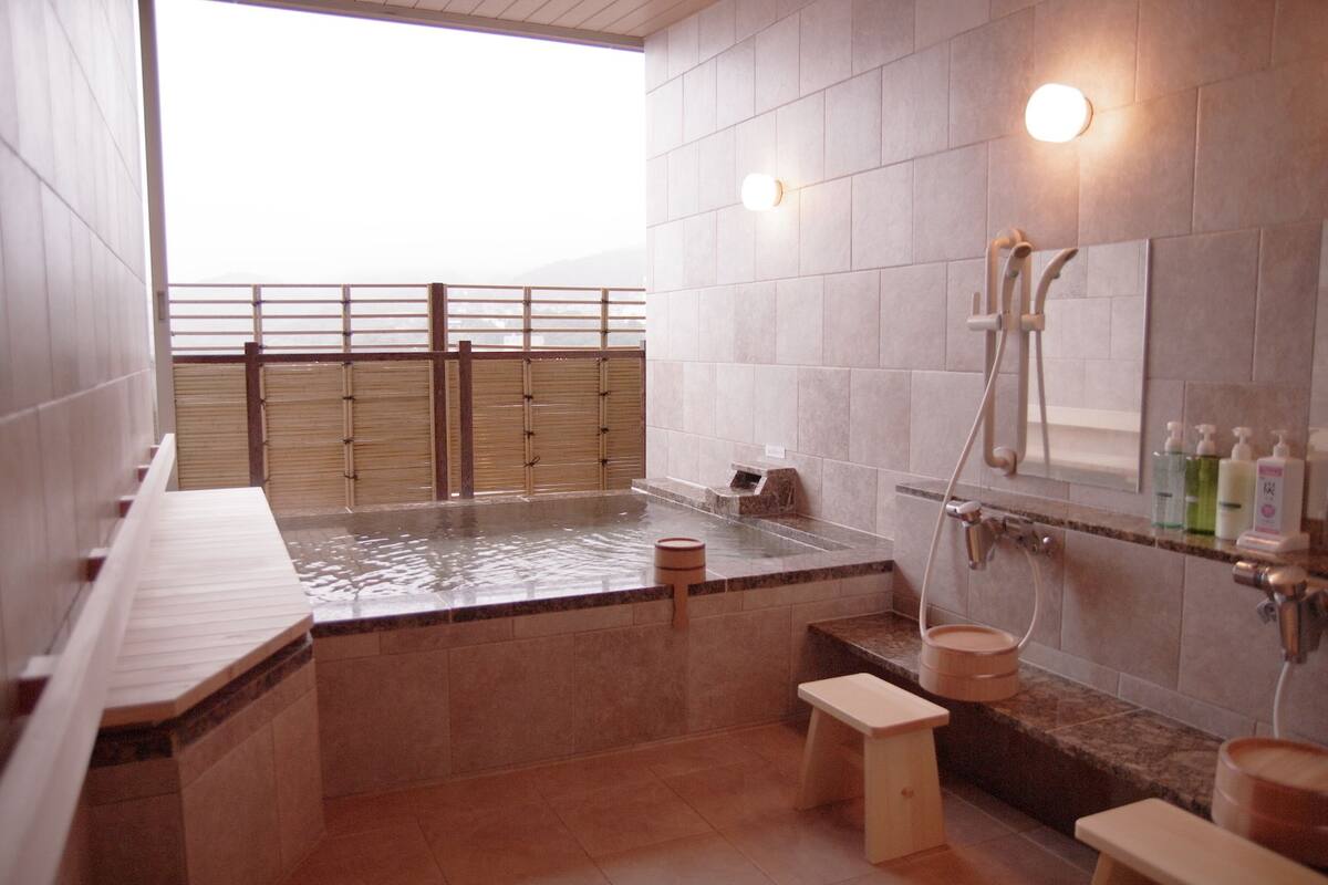 shower, hair dryer, slippers, electronic bidet