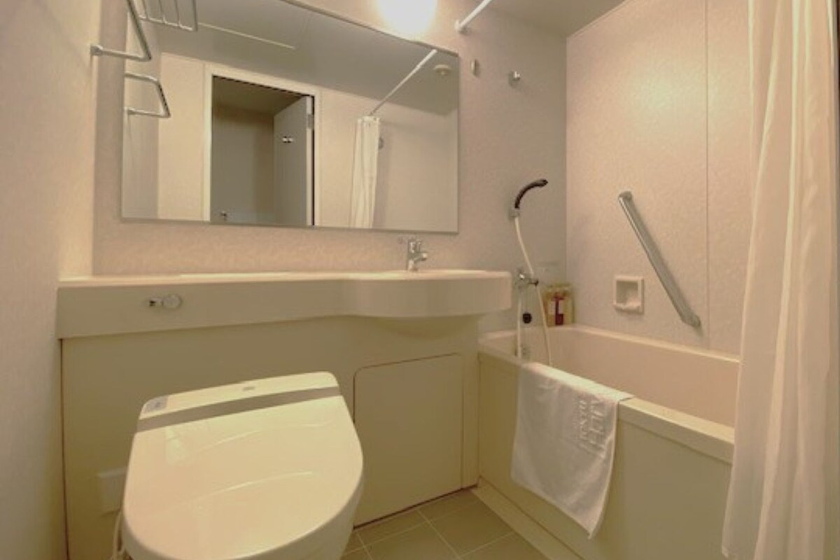 Shower, hair dryer (on request), slippers, electronic bidet