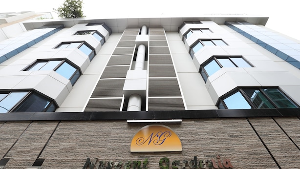 A building with a stone facade and a sign reading "Nongor". - Nascent Gardenia Baridhara (Dhaka)