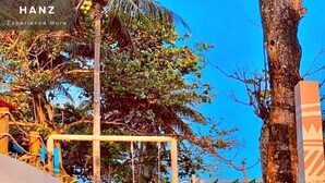 A staircase leading to a beach area with a sign reading "AND BEACH".