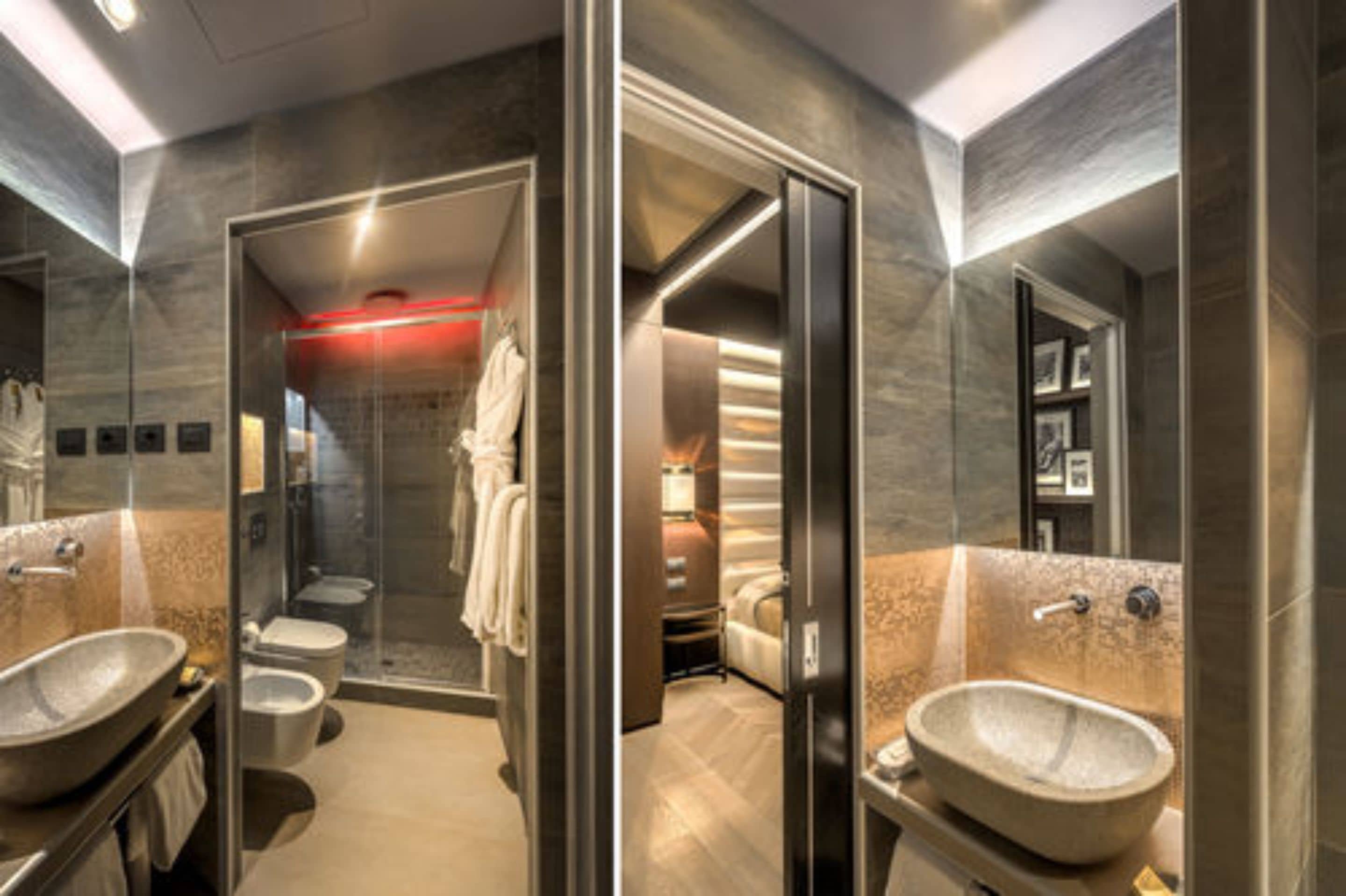 Une salle de bain moderne dotée d’une douche à parois de verre, d’un grand lavabo et d’un espace toilettes séparé.
